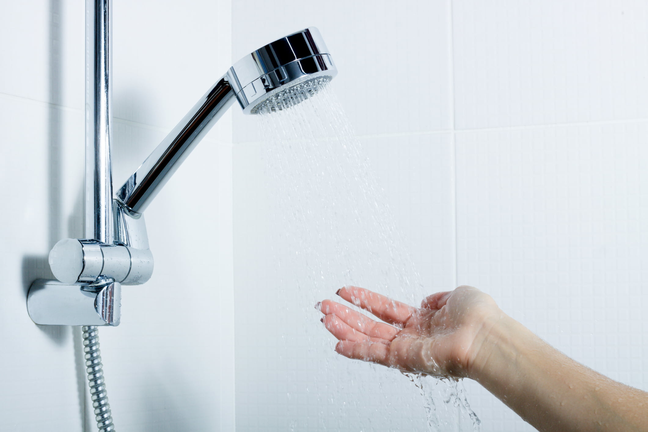 A lady's hand under showering